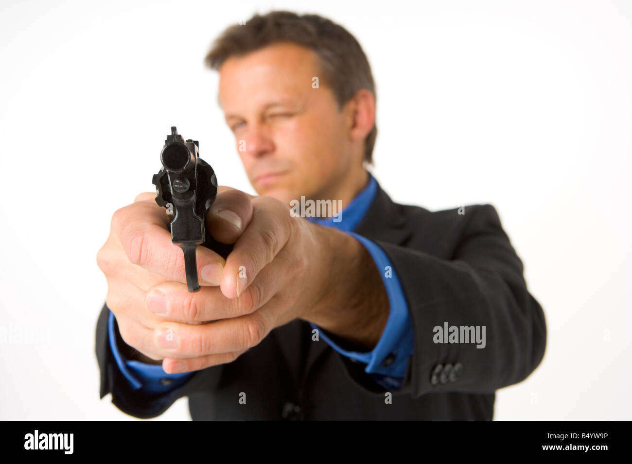Businessman Pointing Gun Stock Photo