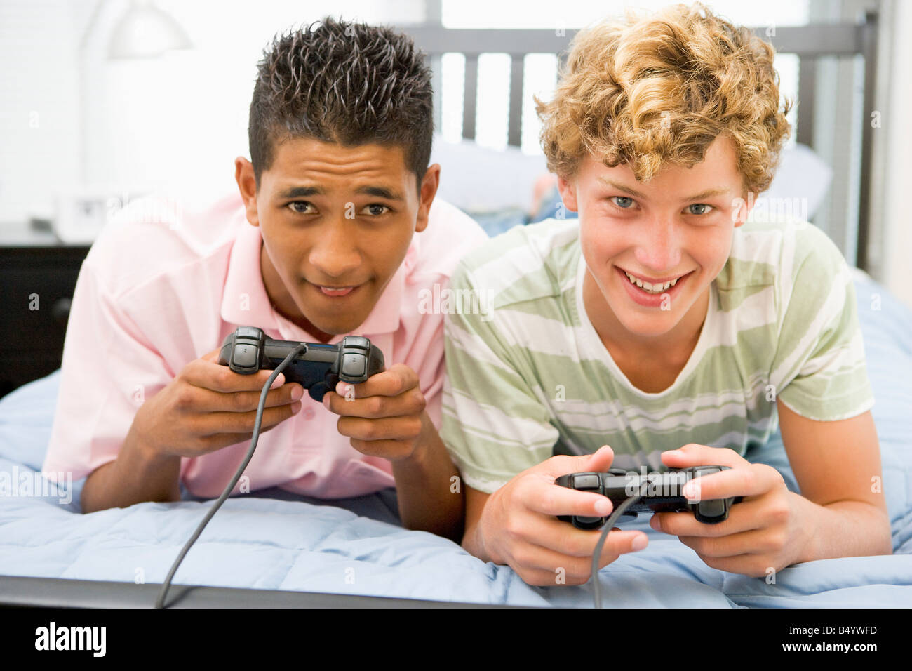 Boy playing a video game - Stock Image - T485/0068 - Science Photo