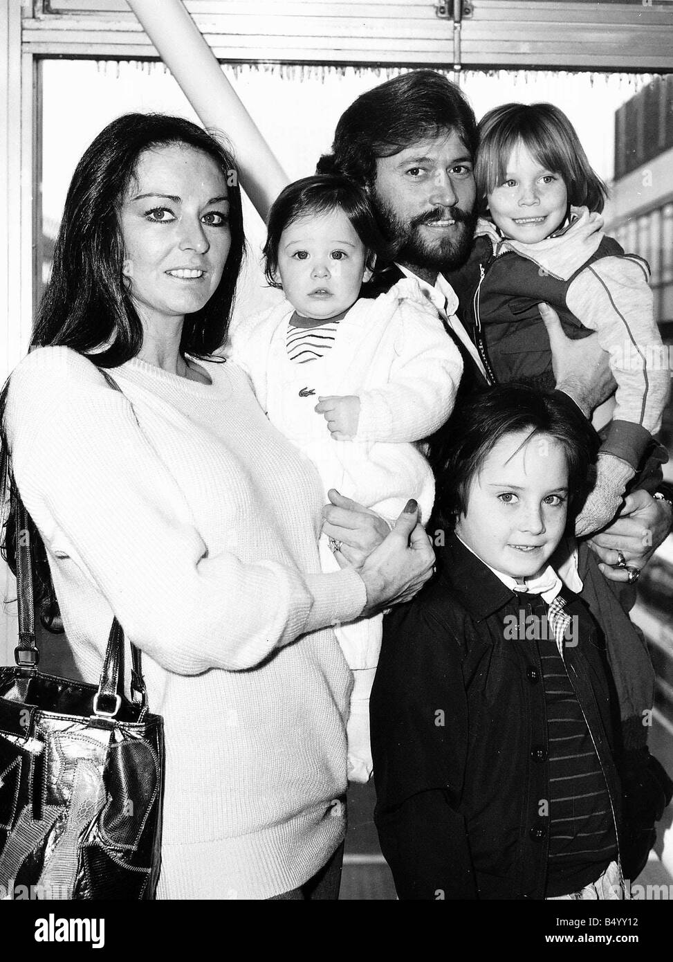 The Bee Gees pop group 1982 Barry Gibb with wife Linda and children Travis 1 Ashley 4 and Stevie 8 Stock Photo