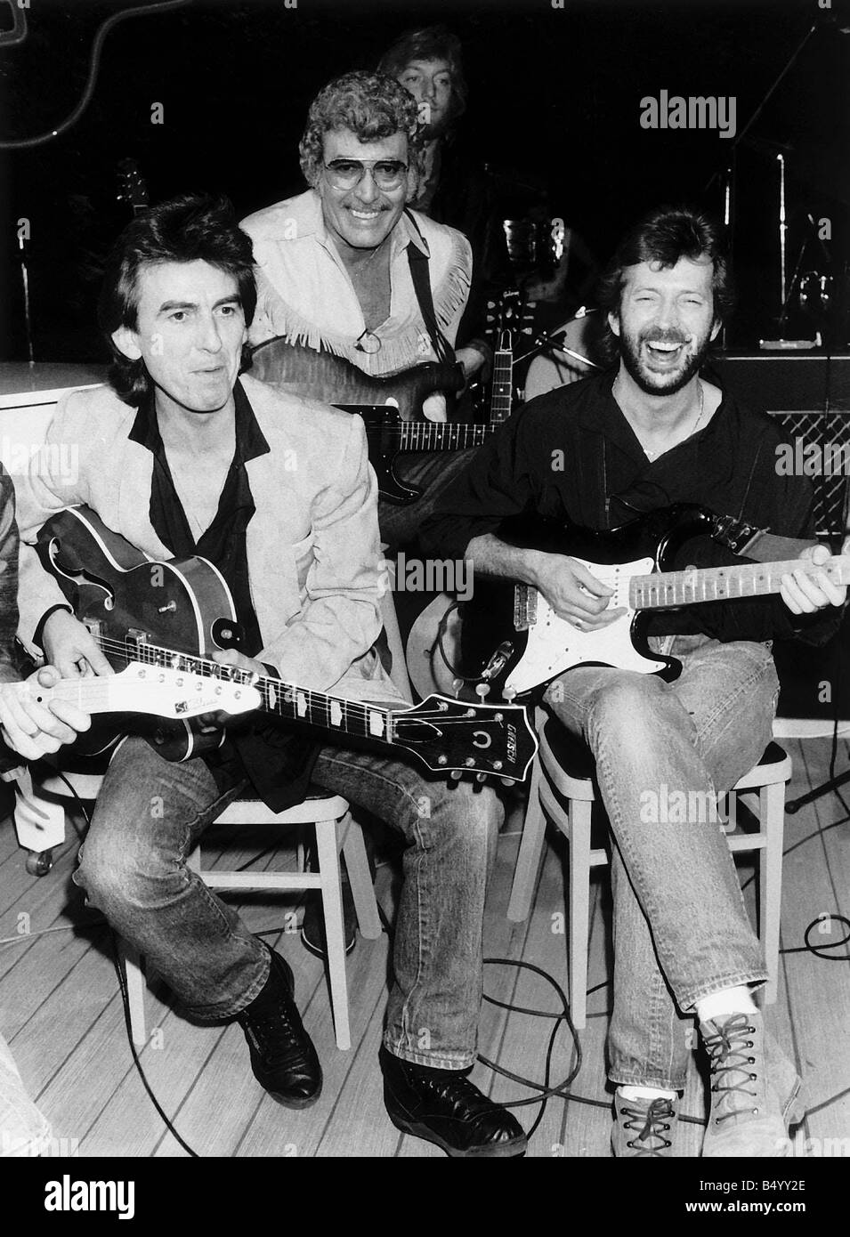Carl Perkins pop singer with George Harrison Eric Clapton 1985 Stock Photo