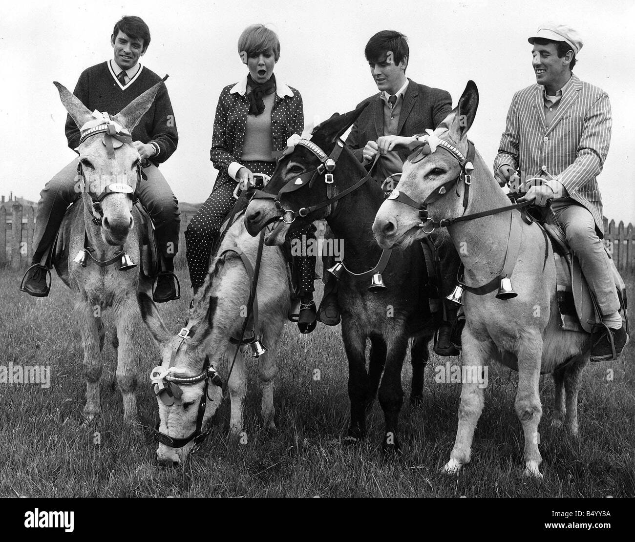 Cilla Black pop singer entertainer with The Bachelors 1966 riding on donkeys Stock Photo