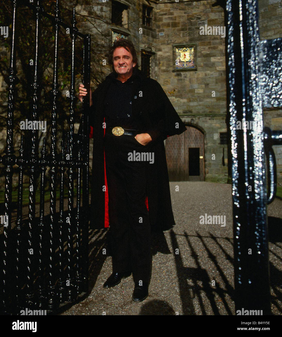 Johnny Cash at gates of castle Stock Photo