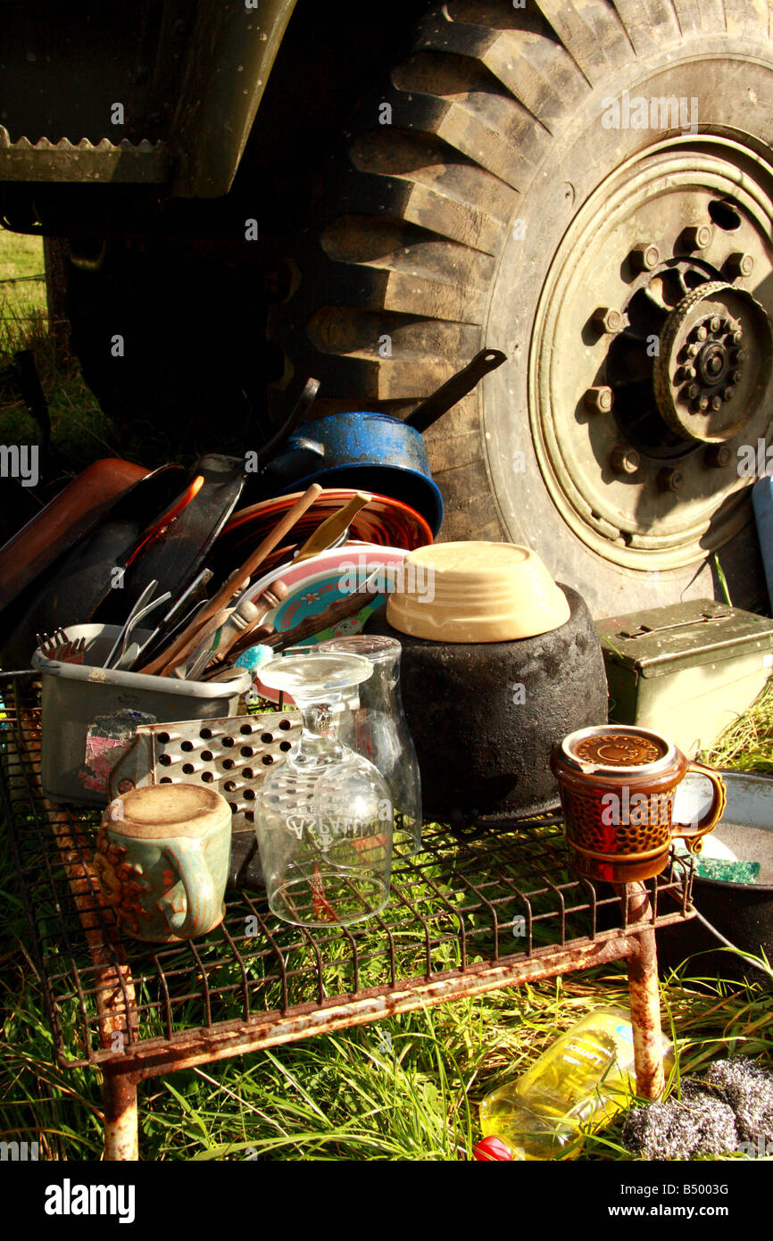 A jumble of kitchen utensils near a lorry tyre Stock Photo - Alamy