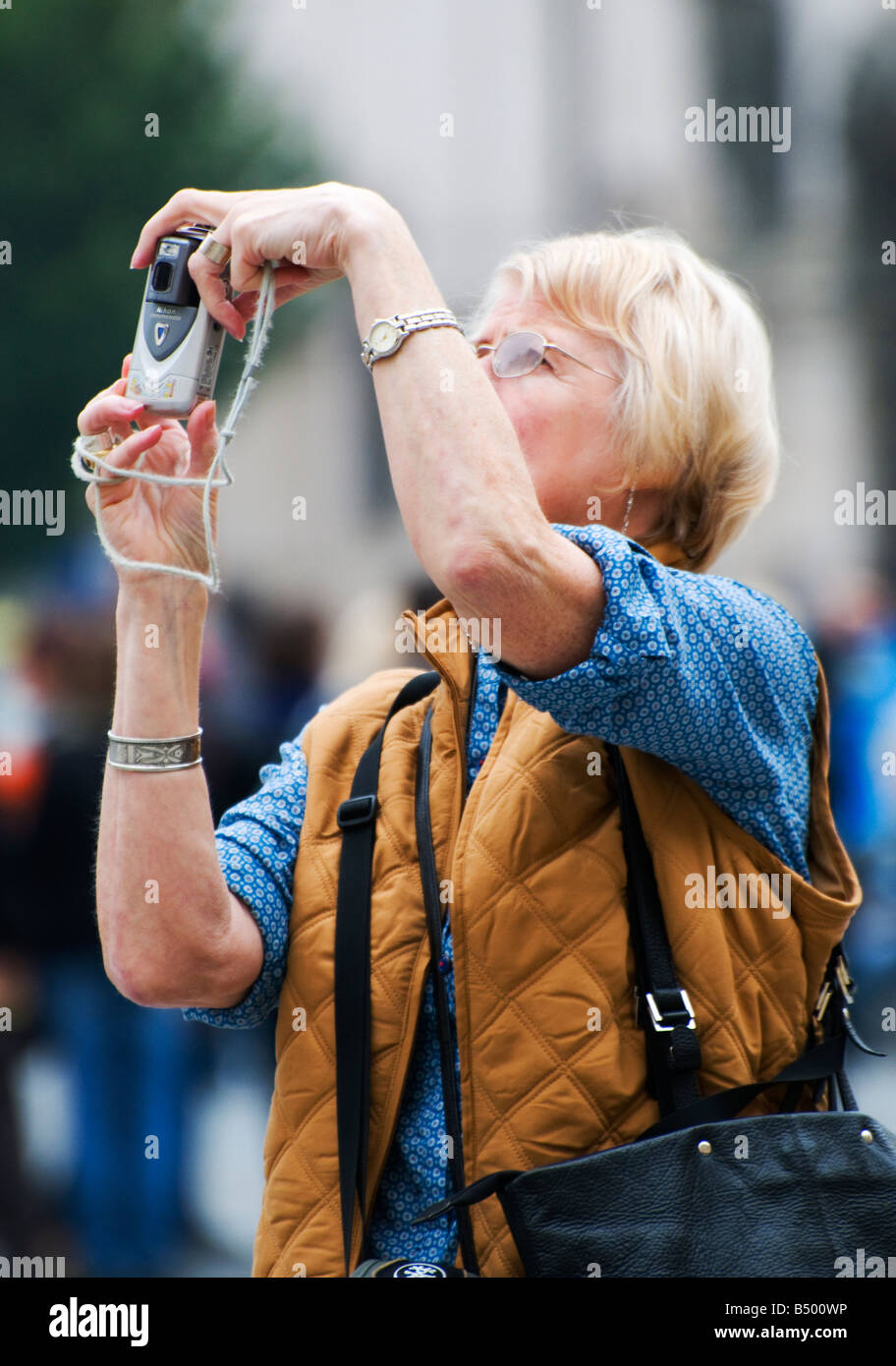 Woman Tourist photographing in the Old Town Square Prague FOR EDITORIAL USE ONLY Stock Photo
