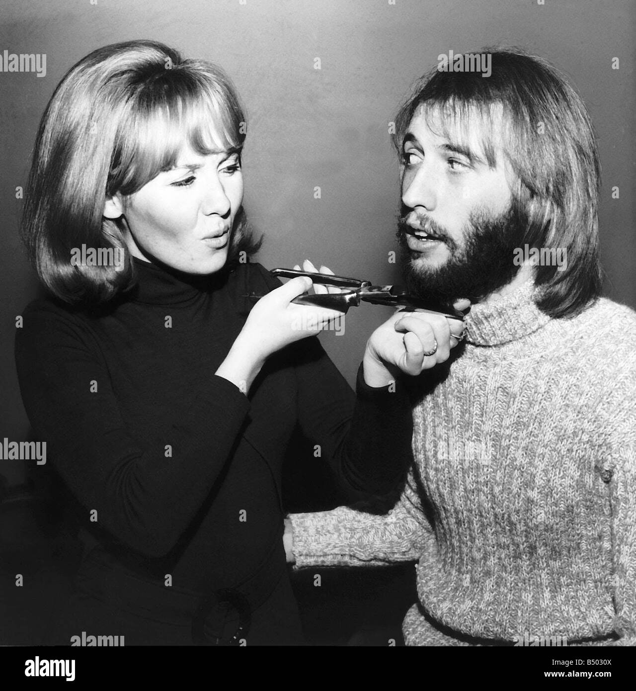 Lulu singer giving husband Maurice Gibb of the Bee Gees a shave Stock Photo