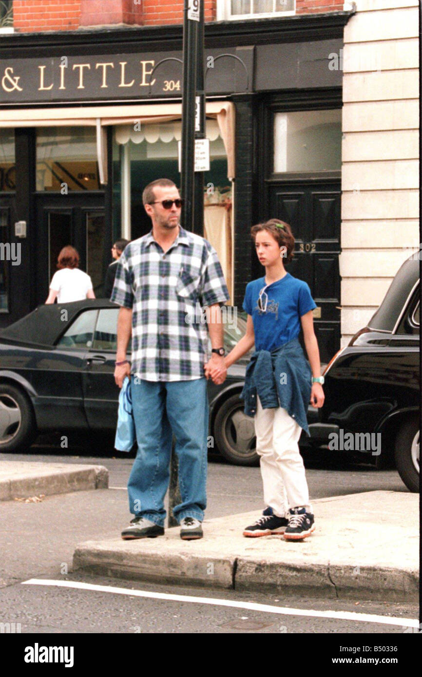 Eric Clapton musician and his daughter hold hands as they shop in the Kings Road London Stock Photo