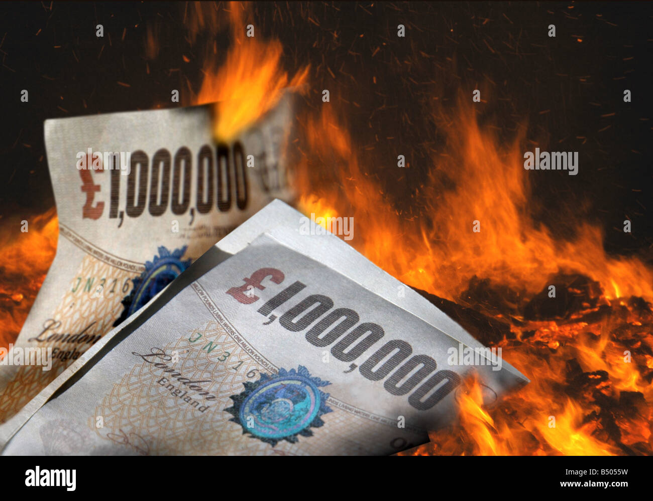 Fake million pound notes burning in a bonfire. Stock Photo