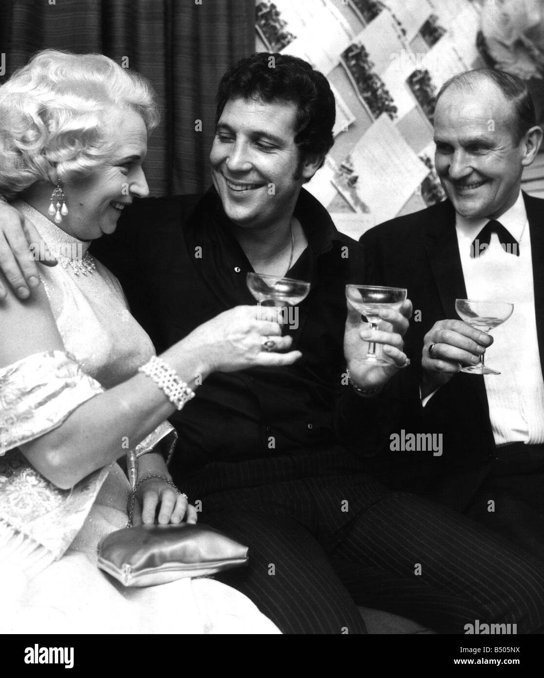Singer Tom Jones with his parents drinking champagne in his dressing room  on the night of the Royal Variety Performance at the London Palladium Stock  Photo - Alamy