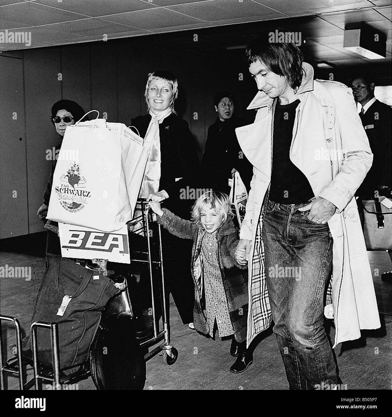 Charlie Watts His Wife Shirley And Their Three Year Old Daughter Seen Here Leaving Heathrow For Nice Stock Photo Alamy