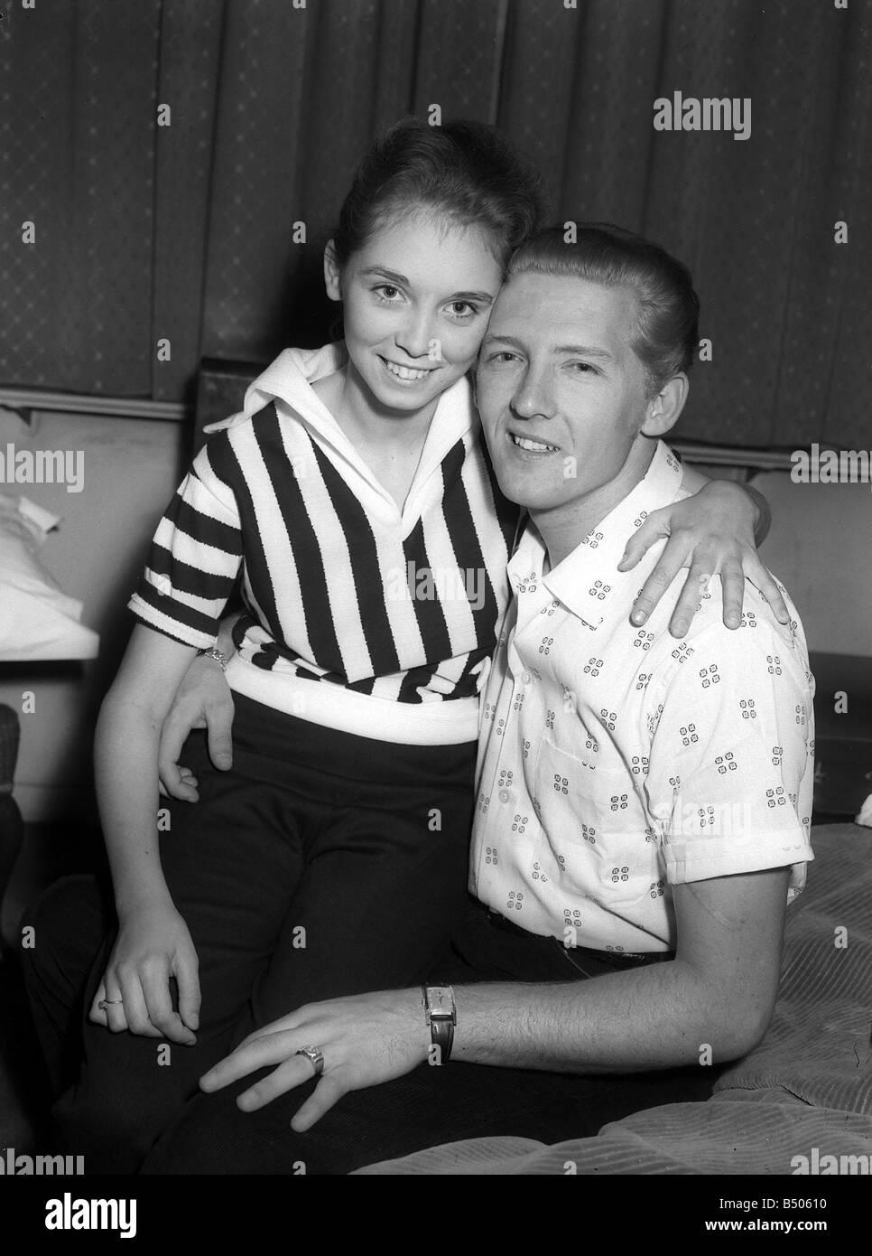 Jerry Lee Lewis Rock and Roll singer May 1958 with his 13 year old wife Myra sitting on his knee Stock Photo