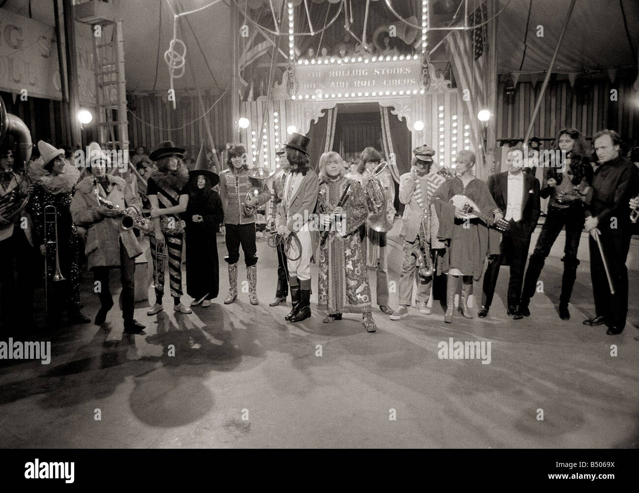 The Rolling Stones December 1968 Pictured after recording their Rock and Roll Circus Show at the Intertel Studios in Wembley London specially recorded for screening over Christmas Mick Jagger Dressed as Ringmaster John Lennon Yoko Ono Keith Richards Charlie Watts Brian Jones Bill Wyman Entertainment Music Studio Groups Circus Performers 1960s Stock Photo