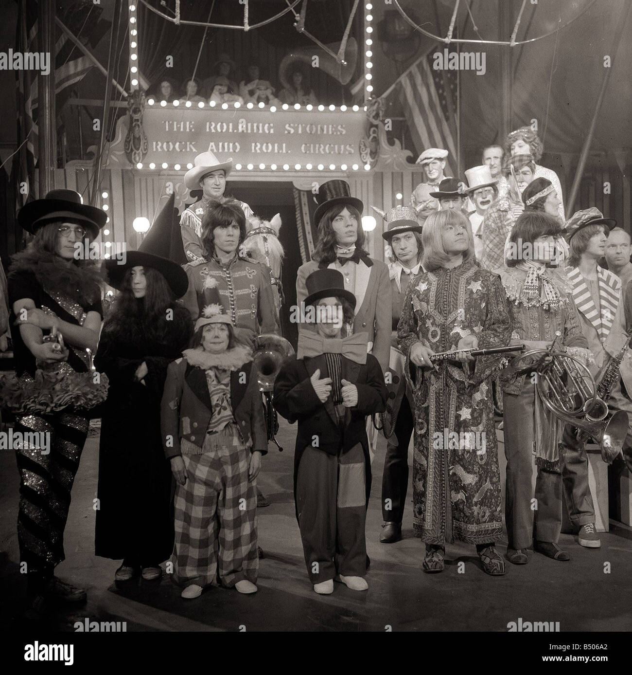 The Rolling Stones December 1968 Pictured after recording their Rock and Roll Circus Show at the Intertel Studios in Wembley London specially recorded for screening over ChristmasMick Jagger Dressed as Ringmaster John Lennon Yoko Ono Keith Richards Charlie Watts Brian Jones Bill Wyman Entertainment Music Studio Groups Circus Performers 1960s Stock Photo