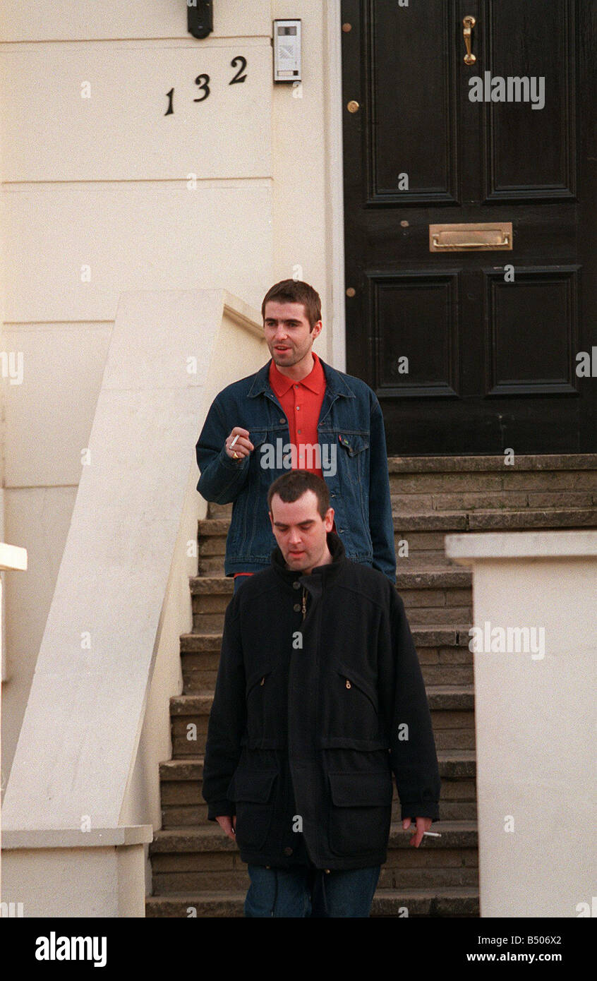 Liam Gallagher Lead Singer With The Pop Group Oasis Leaving His London Home With His Minder Stock Photo