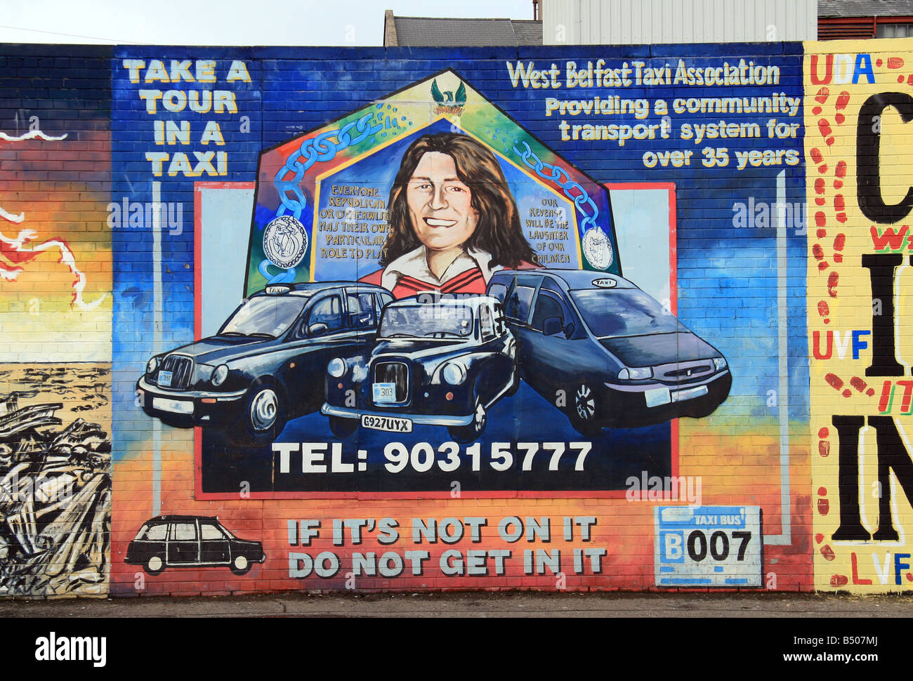 A Bobby Sands mural with Black taxi's on the Solidarity wall on the Falls Road, Belfast. Stock Photo