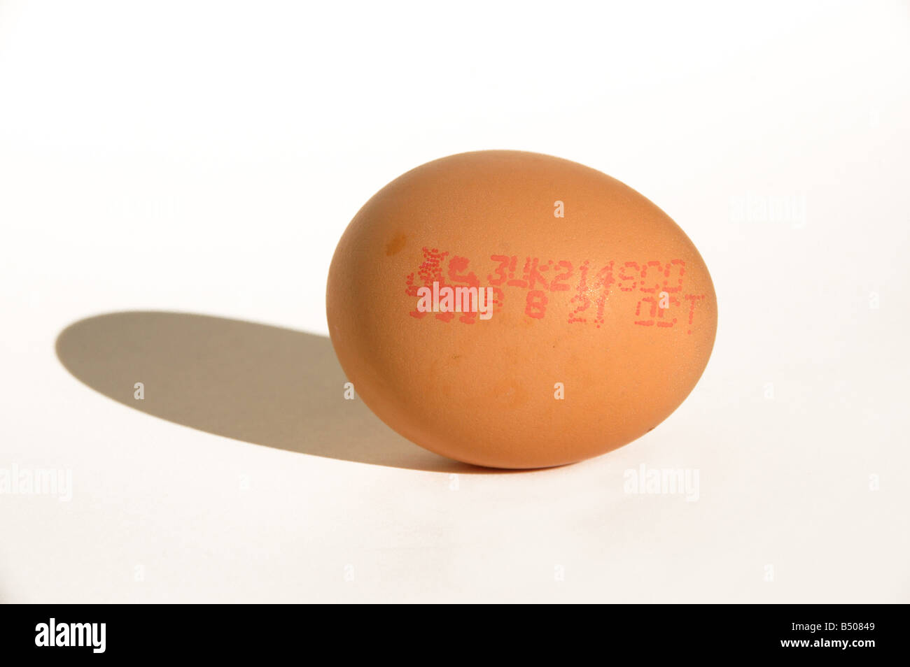 Sell by date printed on an egg Stock Photo Alamy