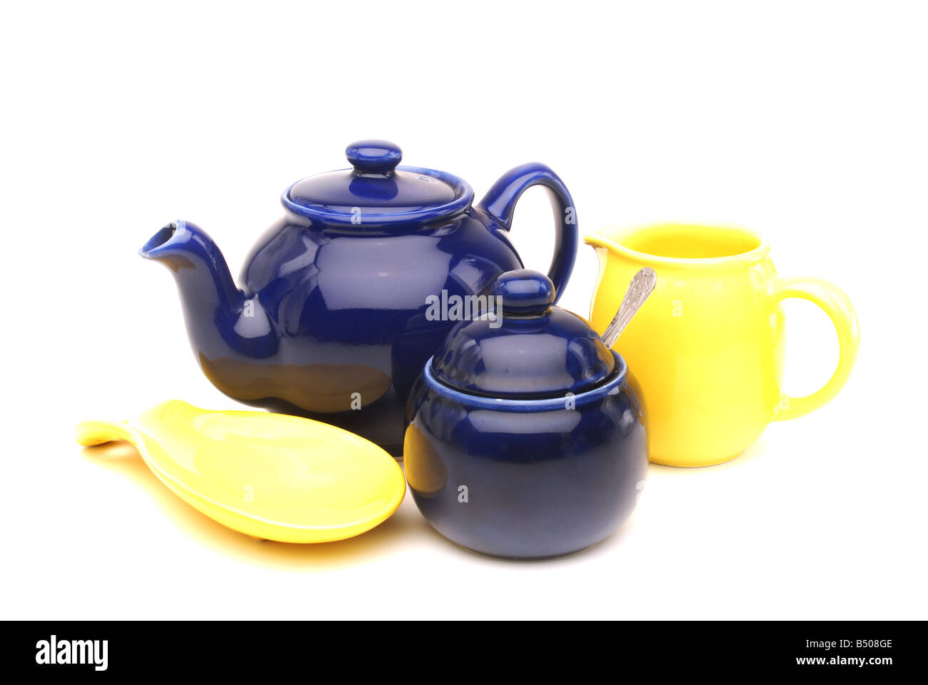 Tea pot, milk jug and sugar pot on white background. Stock Photo