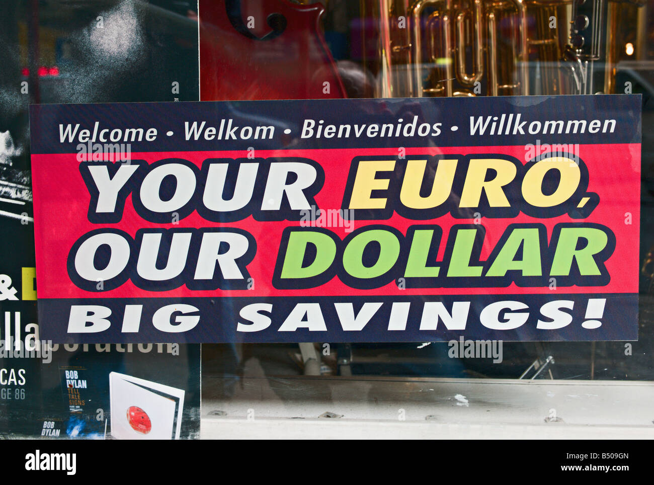 Sign in New York City store window reading Your Euro Our Dollar Big Savings Stock Photo