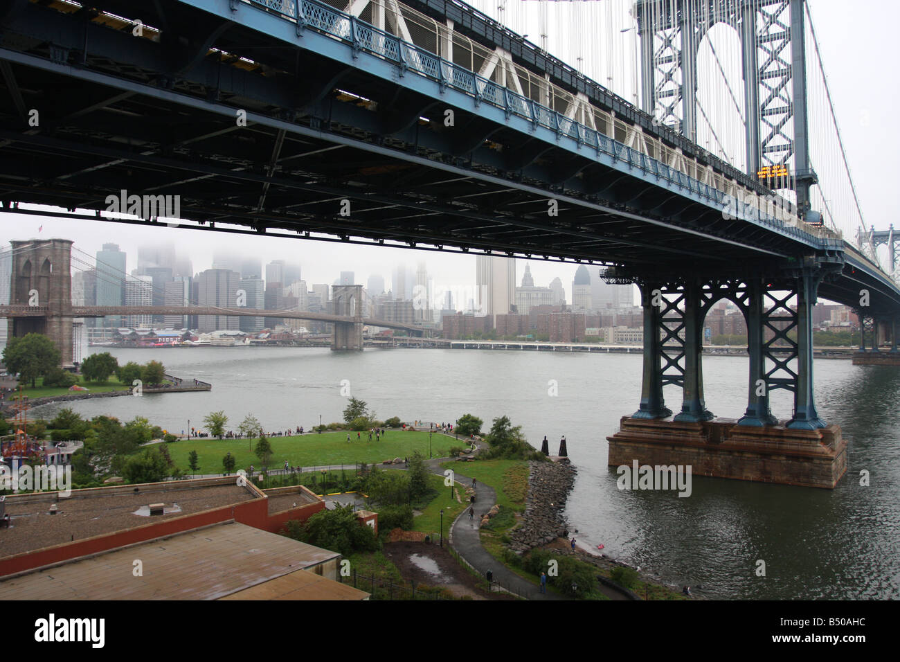 Manhattan Bridge framing the Brooklyn Bridge and Manhattan in the