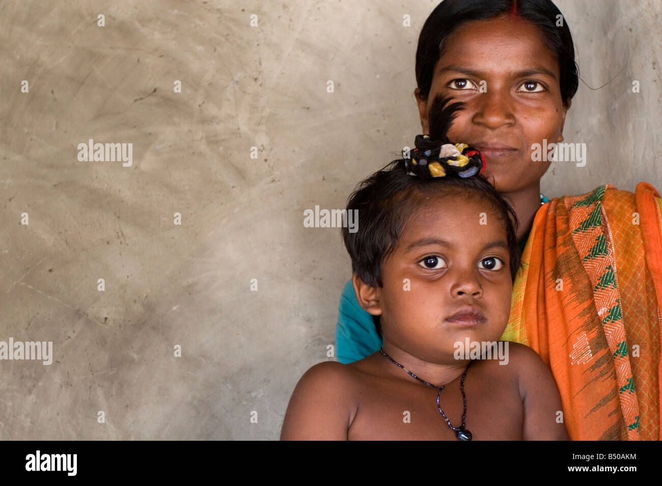 A woman with his girl child. Photograph taken at a remote villahge of ...