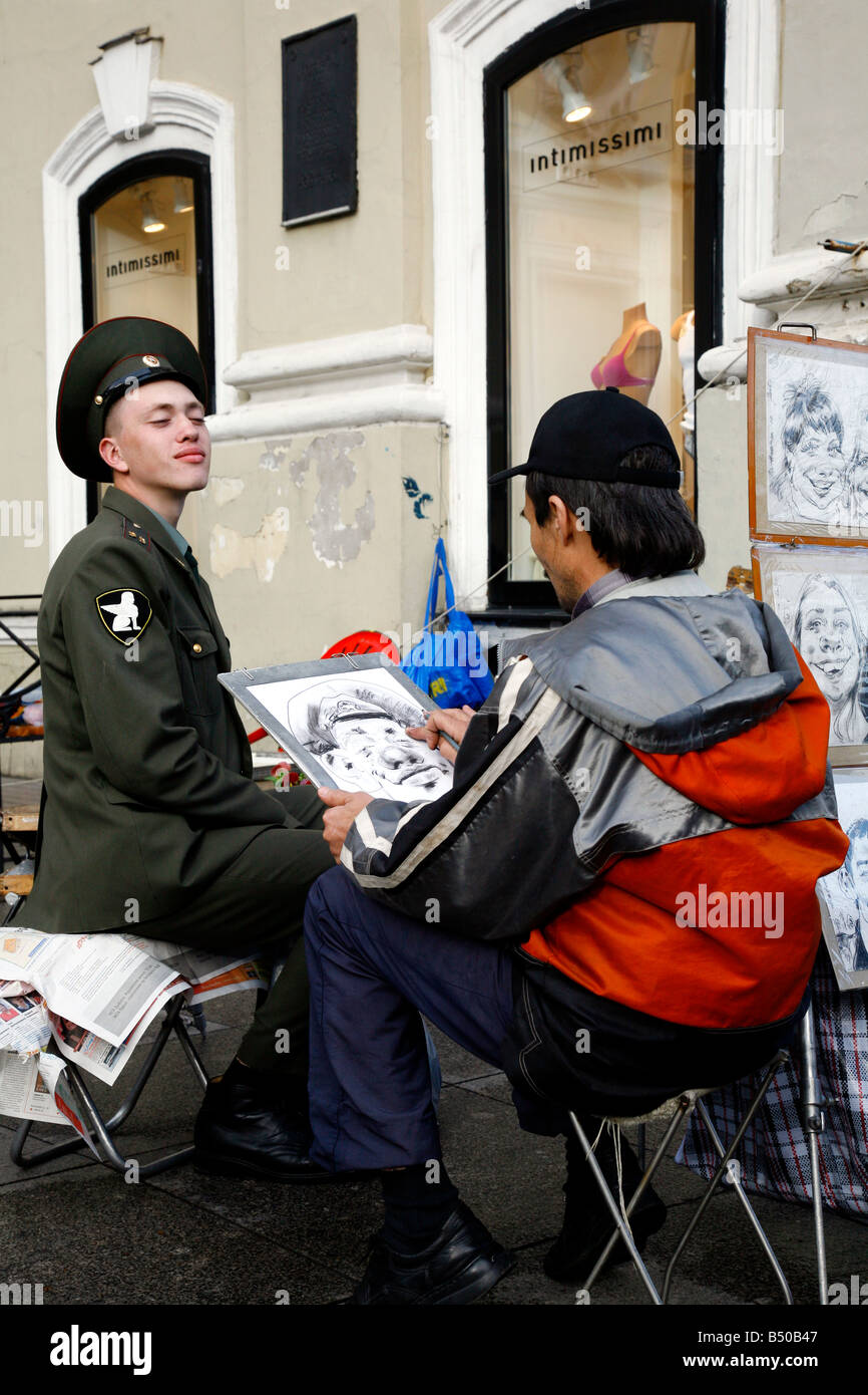 Aug 2008 - Russian soldier having his portrait painted at Nevsky Prospect street St Petersburg Russia Stock Photo