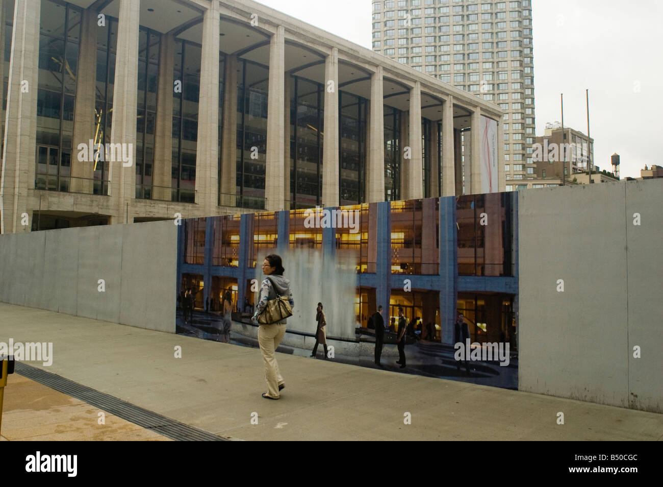 A woman passes by Lincoln Center in New York Stock Photo