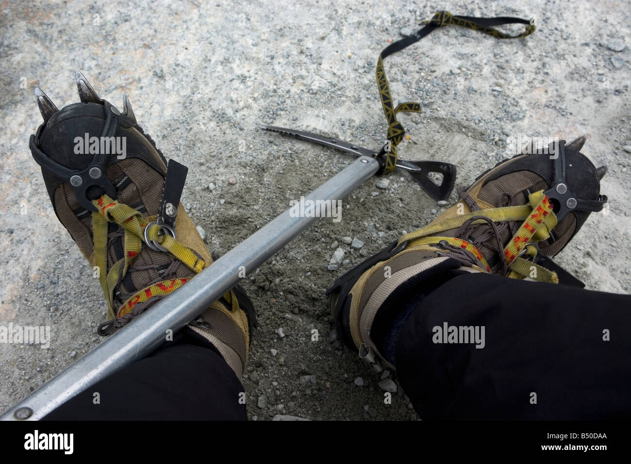 Creepers and ice-axe for mountaineering and glacier hiking Stock Photo -  Alamy