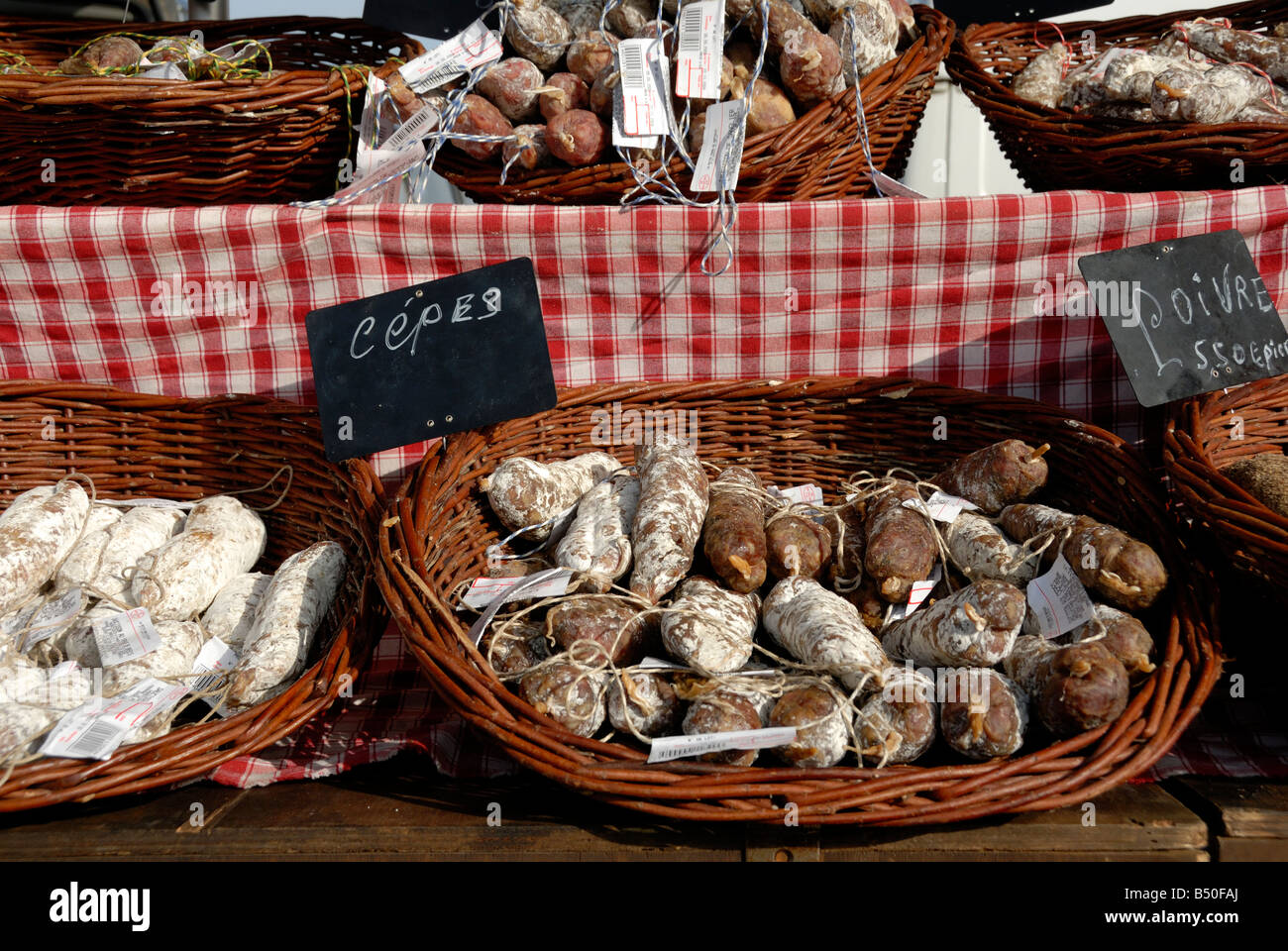 Stock photo of a French market stall selling cured meats This stall is