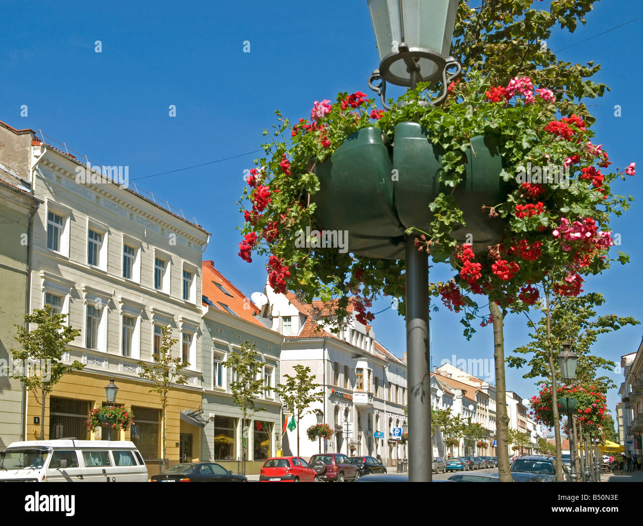 street with new houses and lanterns with flowers old town Klaipeda at the district Klaipeda Memel Territory, East Prussia, Stock Photo