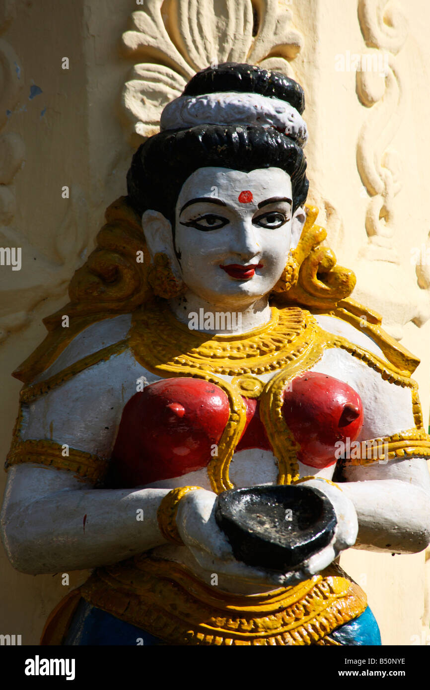 A statue of a woman holding earthen lamp Stock Photo Alamy