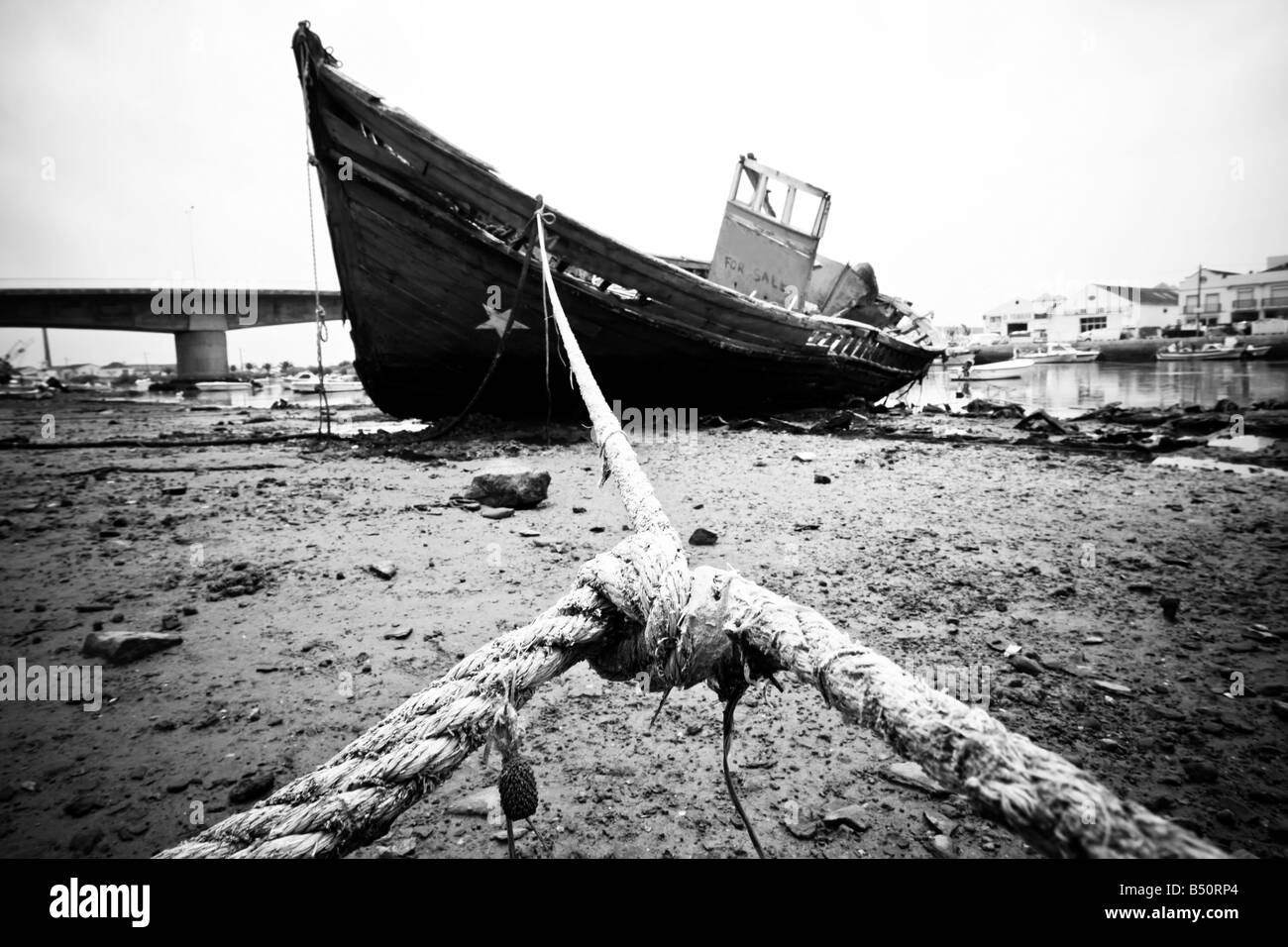 Abandoned wooden ship still strapped Stock Photo - Alamy