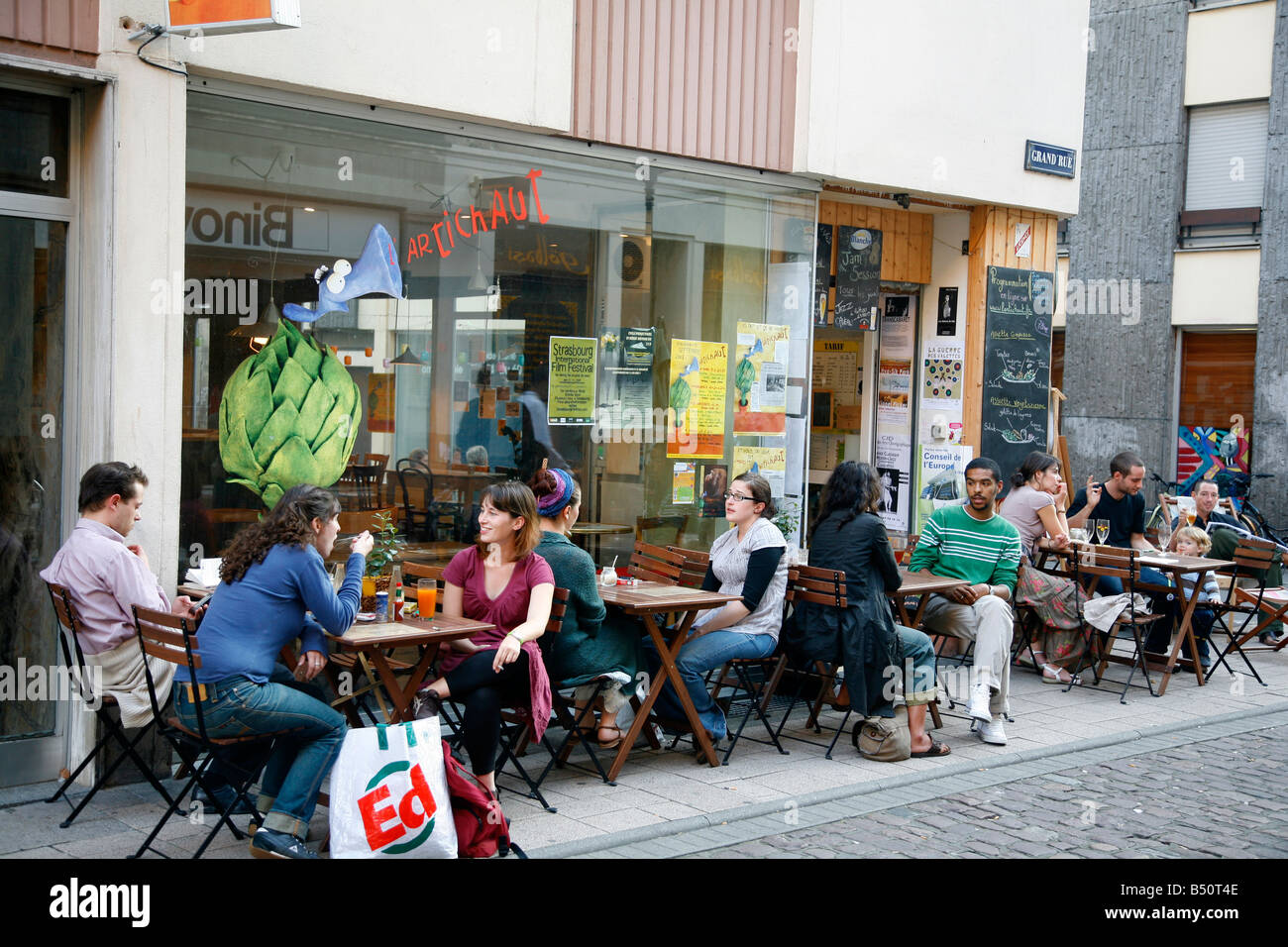 Sep 2008 - People sitting at an outdoors cafe on Grand Rue Strasbourg Alsace France Stock Photo