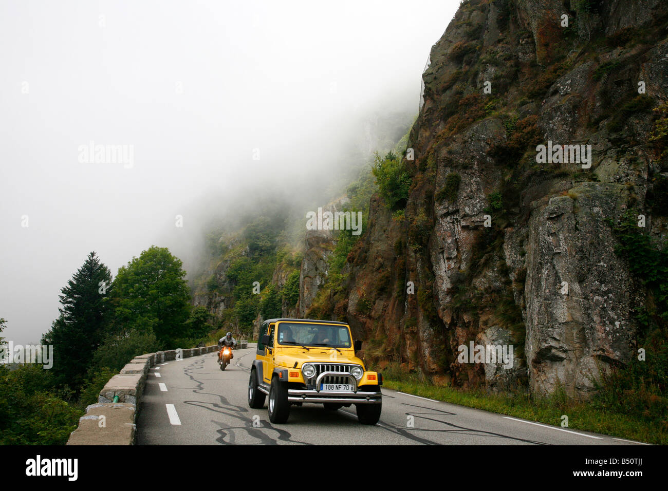 Sep 2008 - Jeep driving along Route des Cretes Route of the Crests in the Vosges mountains Alsace France Stock Photo