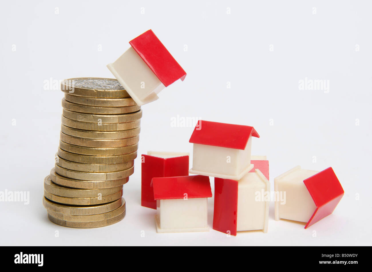 Miniature house on stack of coins, symbolic image real estate Stock Photo