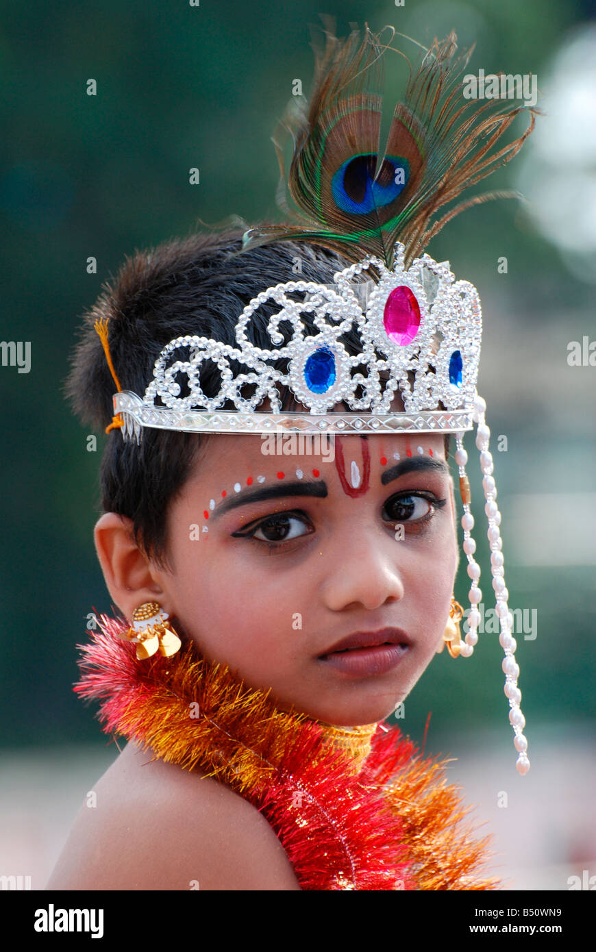 Little Krishna- a small boy posing as lord krishna in a ...