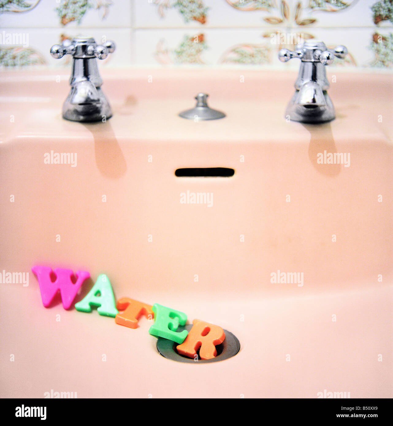 Word WATER in the bathroom sink Stock Photo Alamy