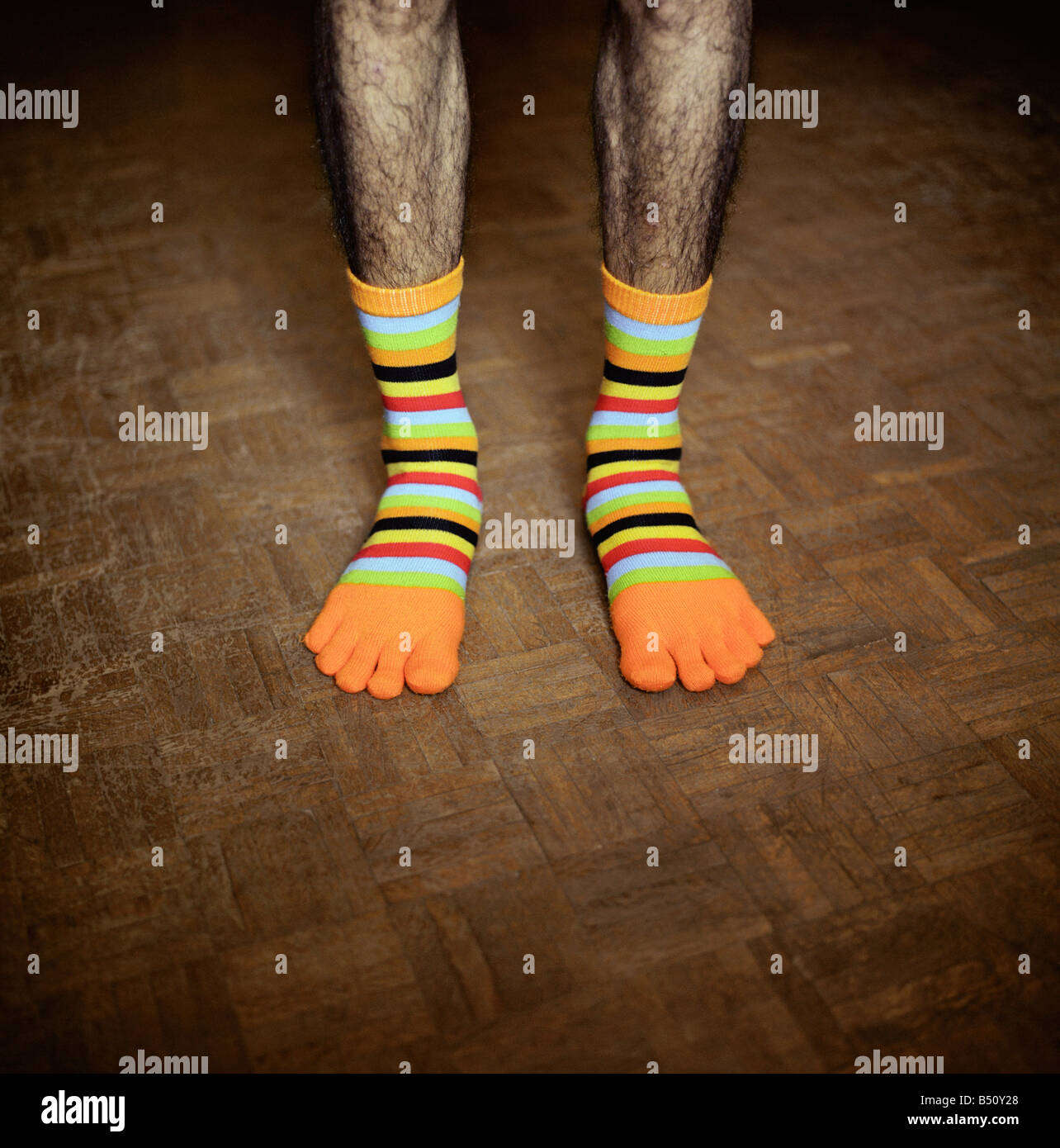 Low section view of a man wearing funny socks Stock Photo Alamy
