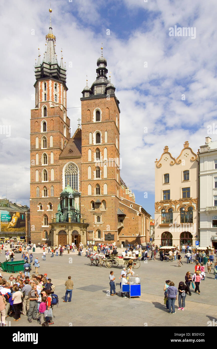 St. Mary's Basilica Gothic church in the Main Market Square of Krakow in Poland . Stock Photo