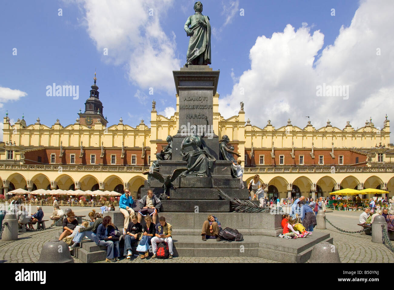 The Adam Mickiewicz Monument in the Main Market Square of Krakow in Poland with the Sukiennice Cloth Hall behind. Stock Photo