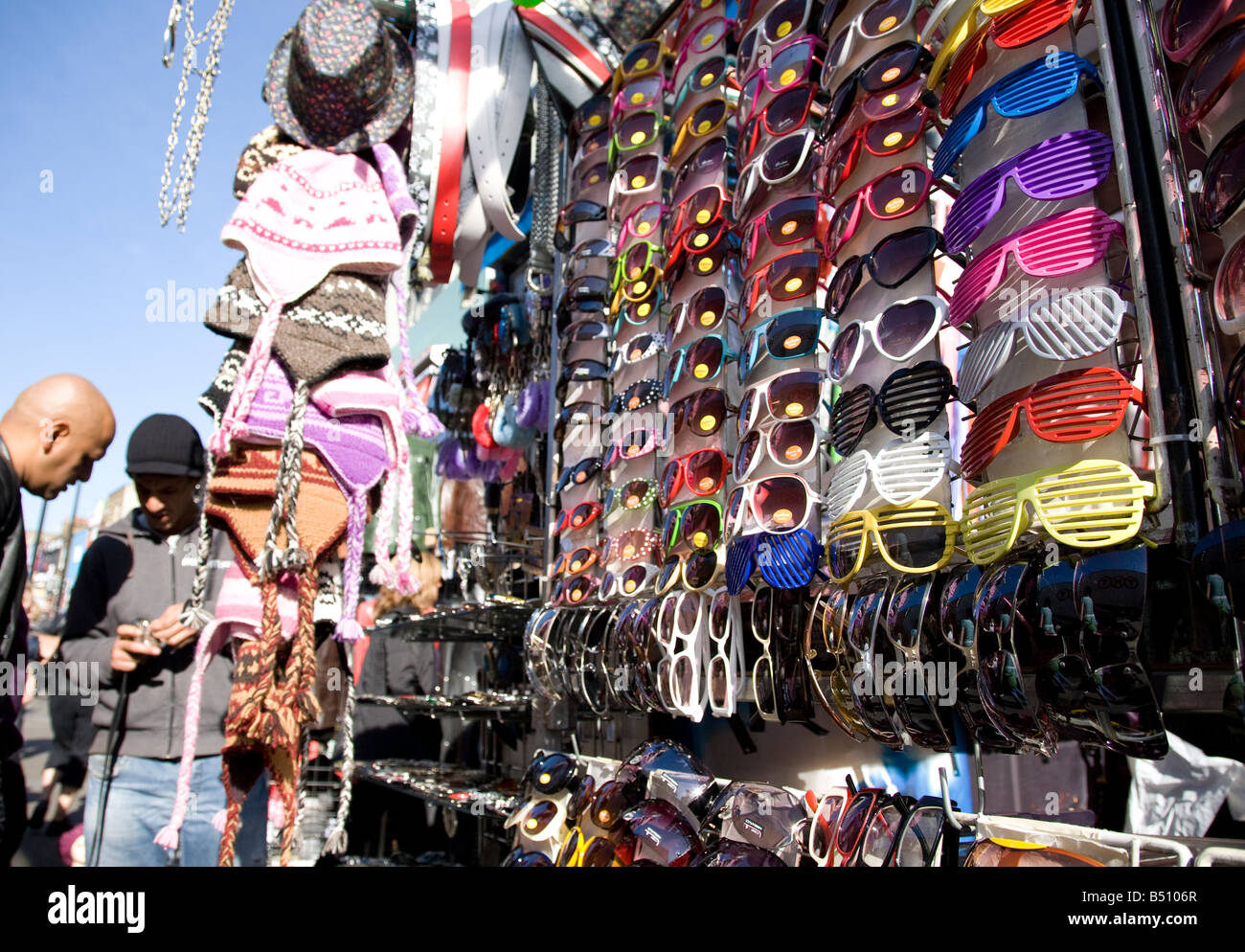 street scene on Chalk Farm Road camden Town London sunglasses for sale on a stall Stock Photo
