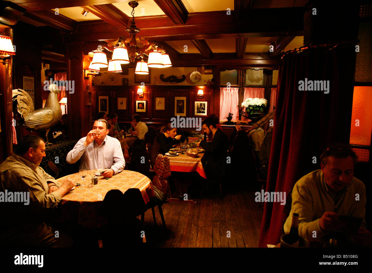 Sep 2008 People sitting at a traditional winstub Chez Yvonne Restaurant Strasbourg Alsace France Stock Photo