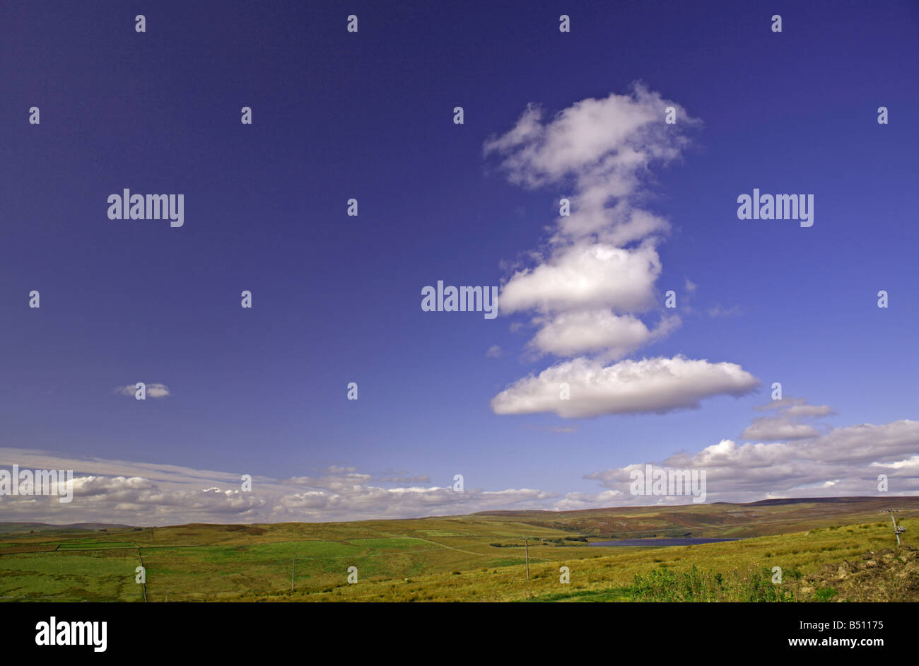 Cumulus clouds over Grimwith Reservoir near Hebden, North Yorkshire Viewed looking northwards from B6265 east of Dibbles Bridge Stock Photo