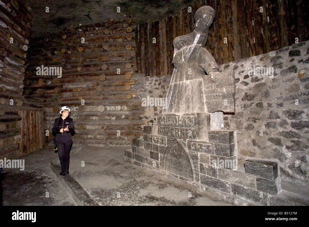 A tour guide explaining about the Nicholas Copernicus Chamber of the Wieliczka Salt Mines in Krakow, Poland. Stock Photo