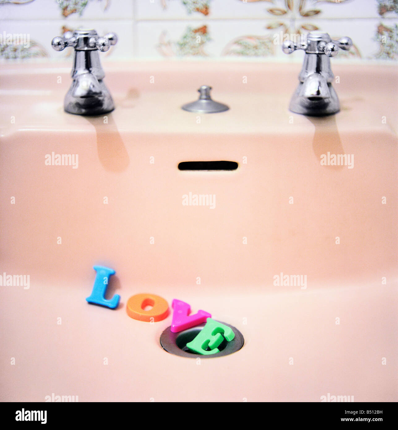 Word LOVE in the bathroom sink Stock Photo Alamy