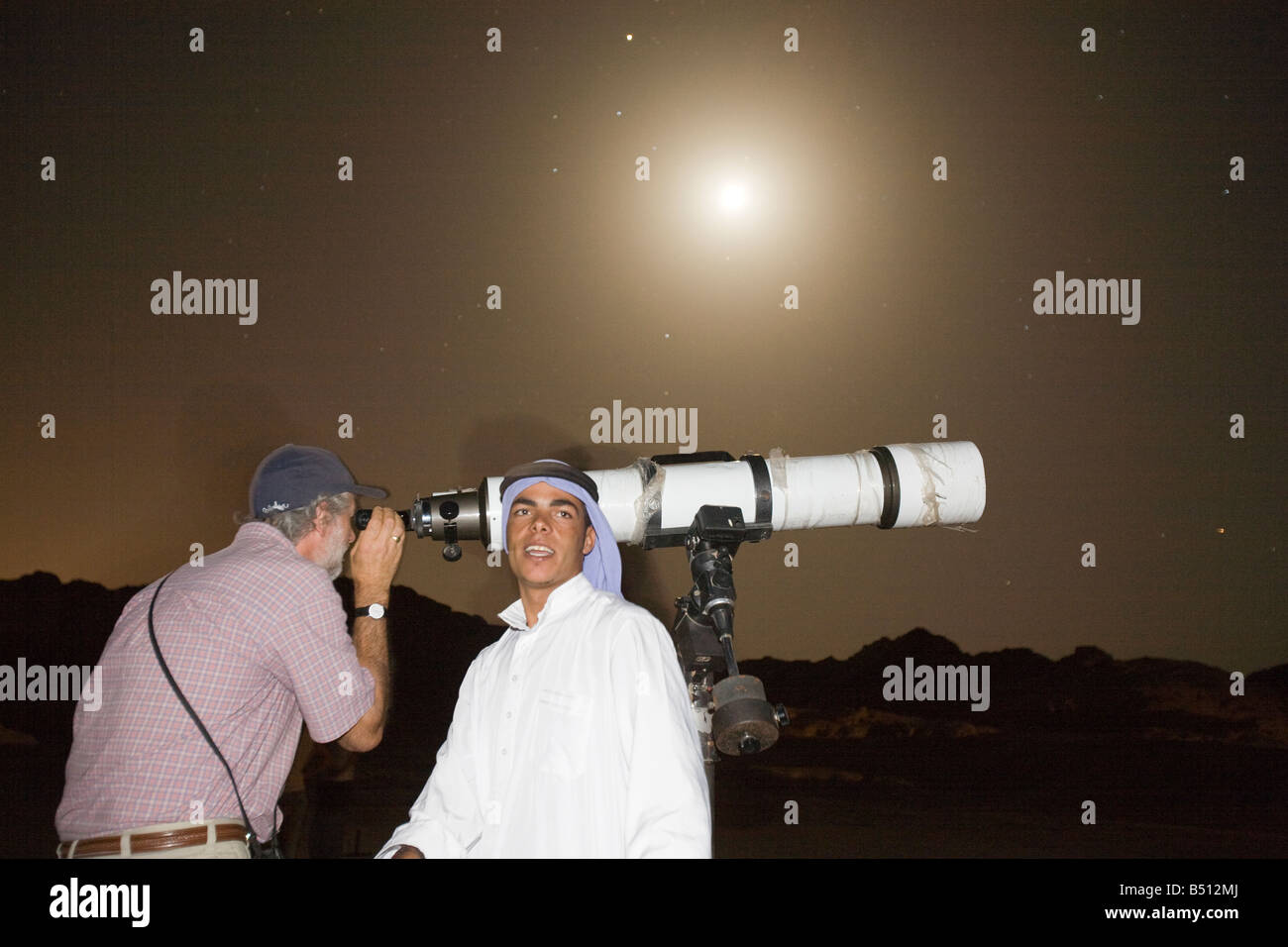 star gazing through a telescope with Bedouin arabs in the Sinai Desert