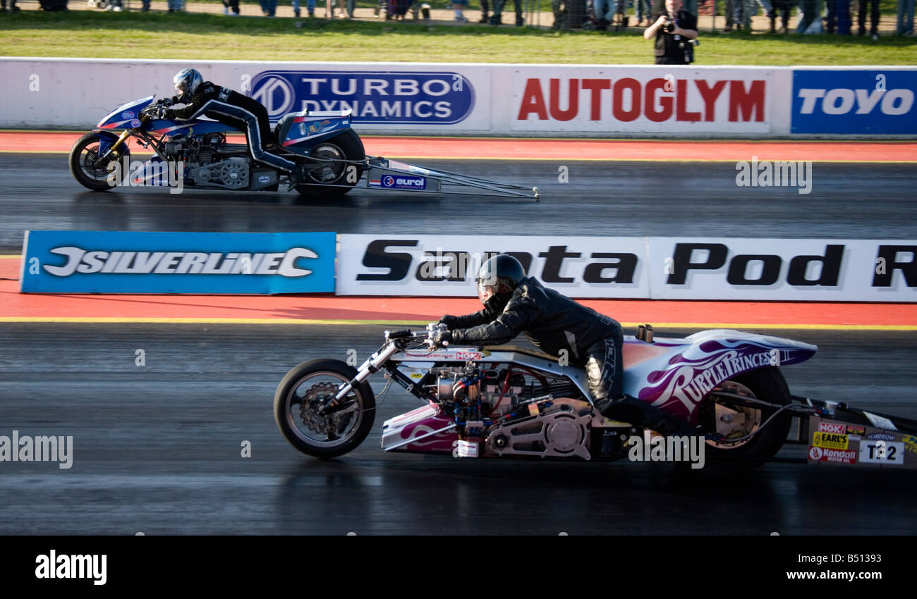 Top Fuel Bike Purple Princess Driven By Steve Carey Drag Racing at Santa Pod, England. Stock Photo