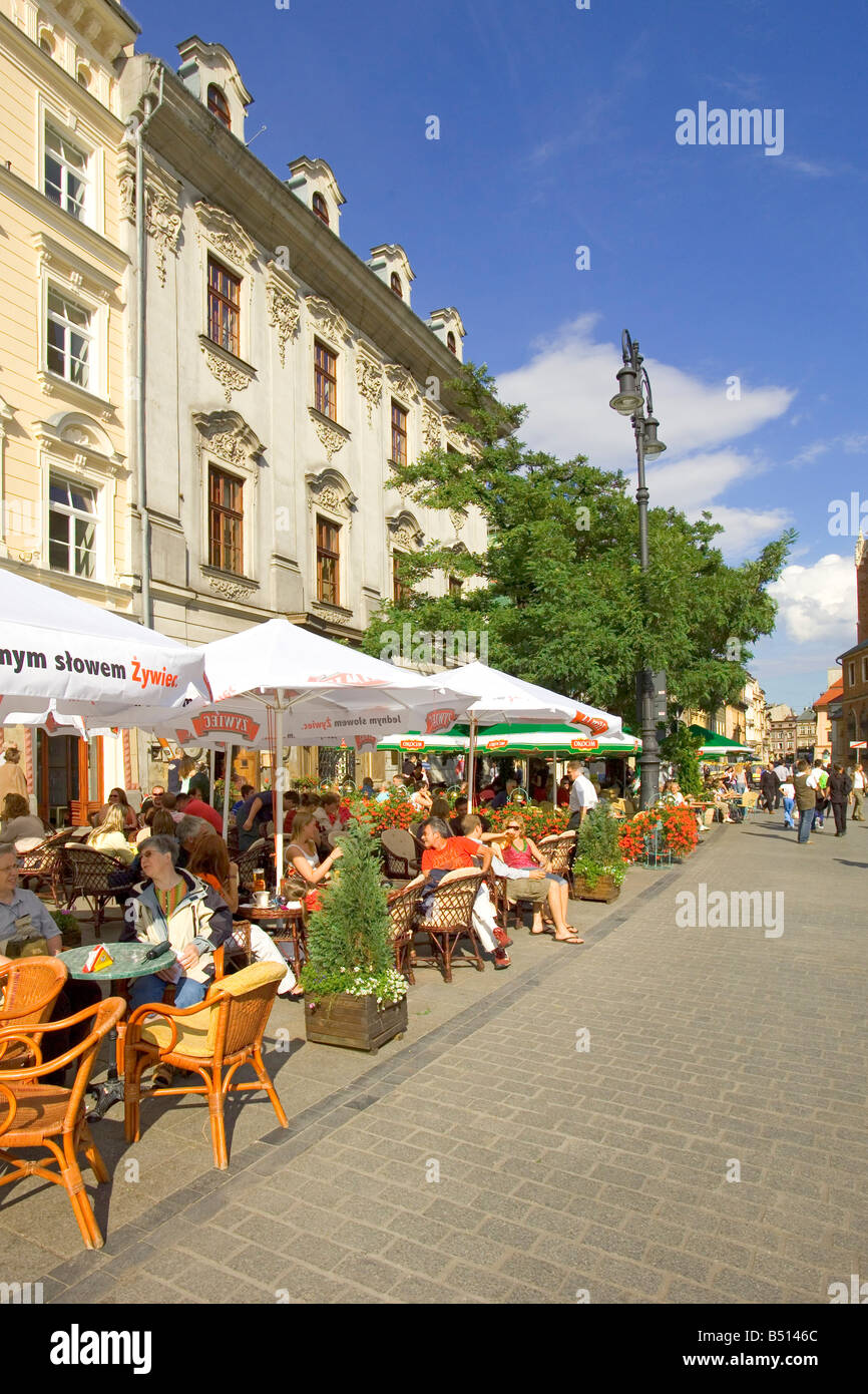 Architecture of The Main Market Square of Krakow in Poland showing the cafe culture. Stock Photo