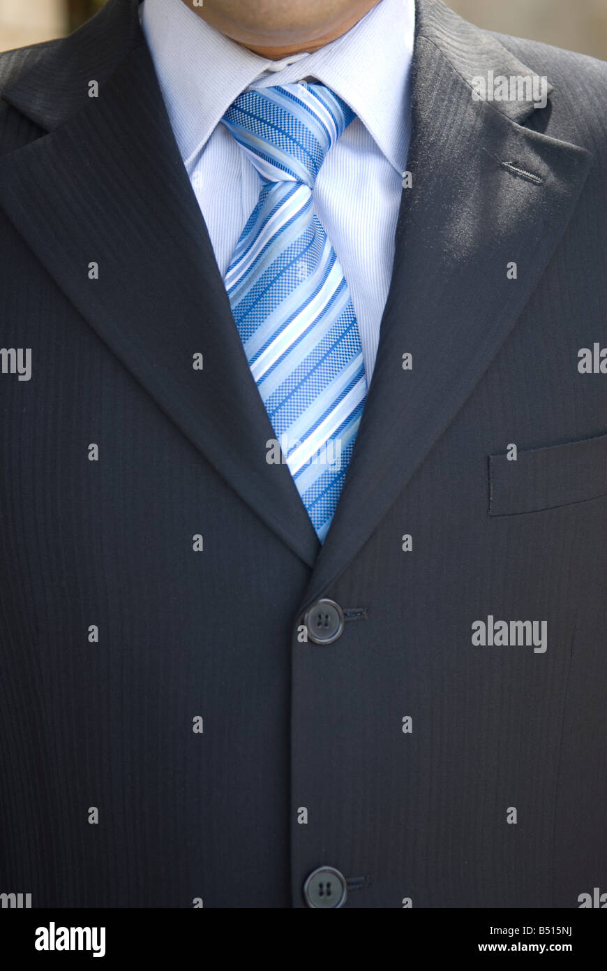 Close up of a business man wearing suit and blue tie Stock Photo - Alamy