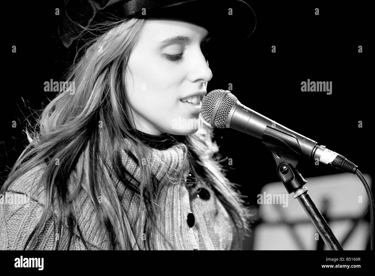 Young female singer performing a live concert Stock Photo Alamy