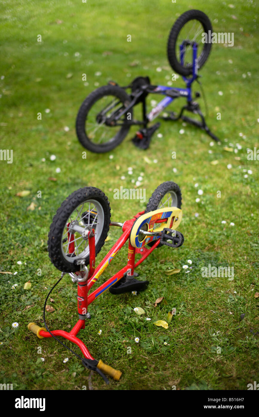 Bike maintenance Childrens bicycles upside down Stock Photo