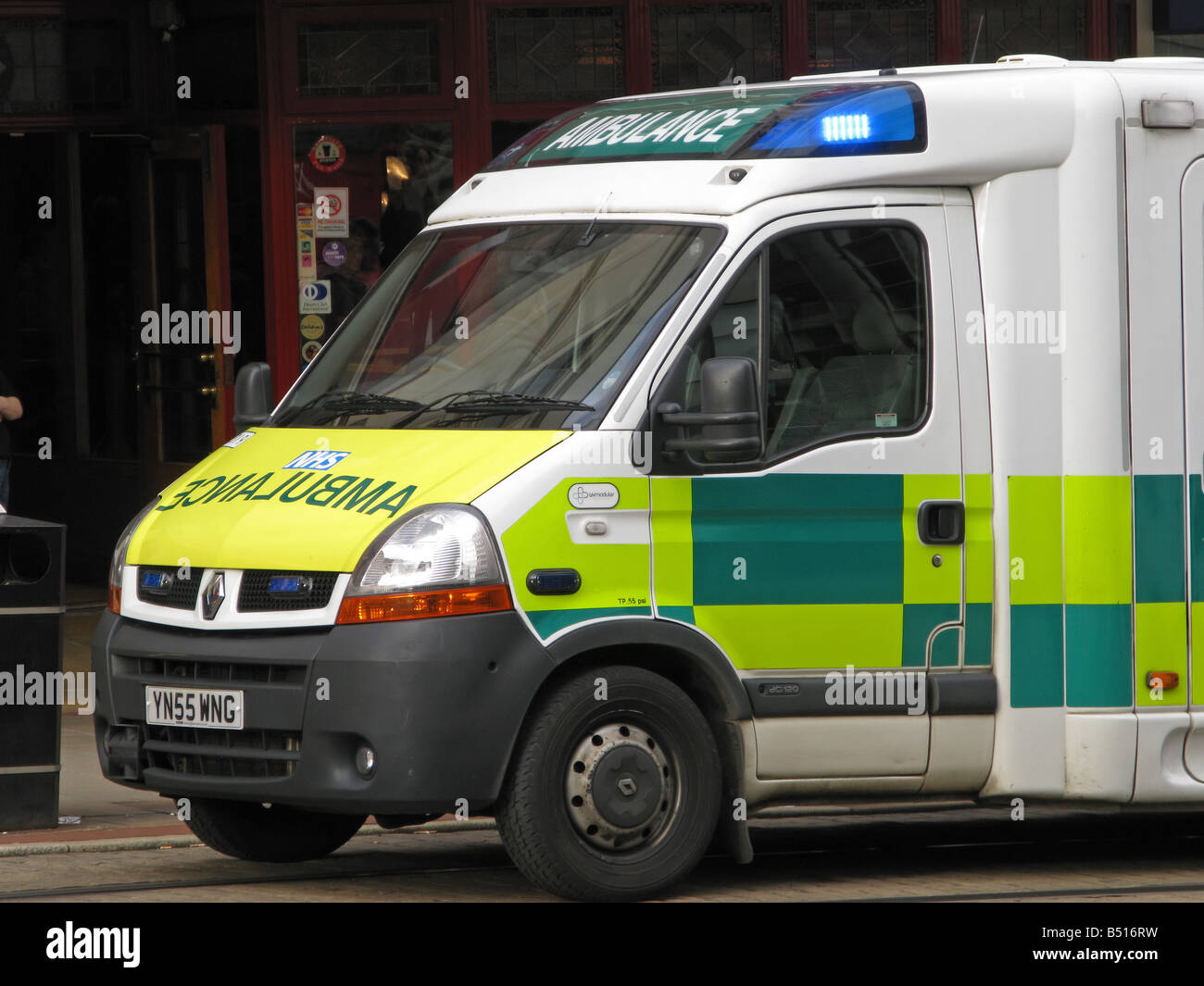 NHS Emergency Ambulance with light flashing Stock Photo